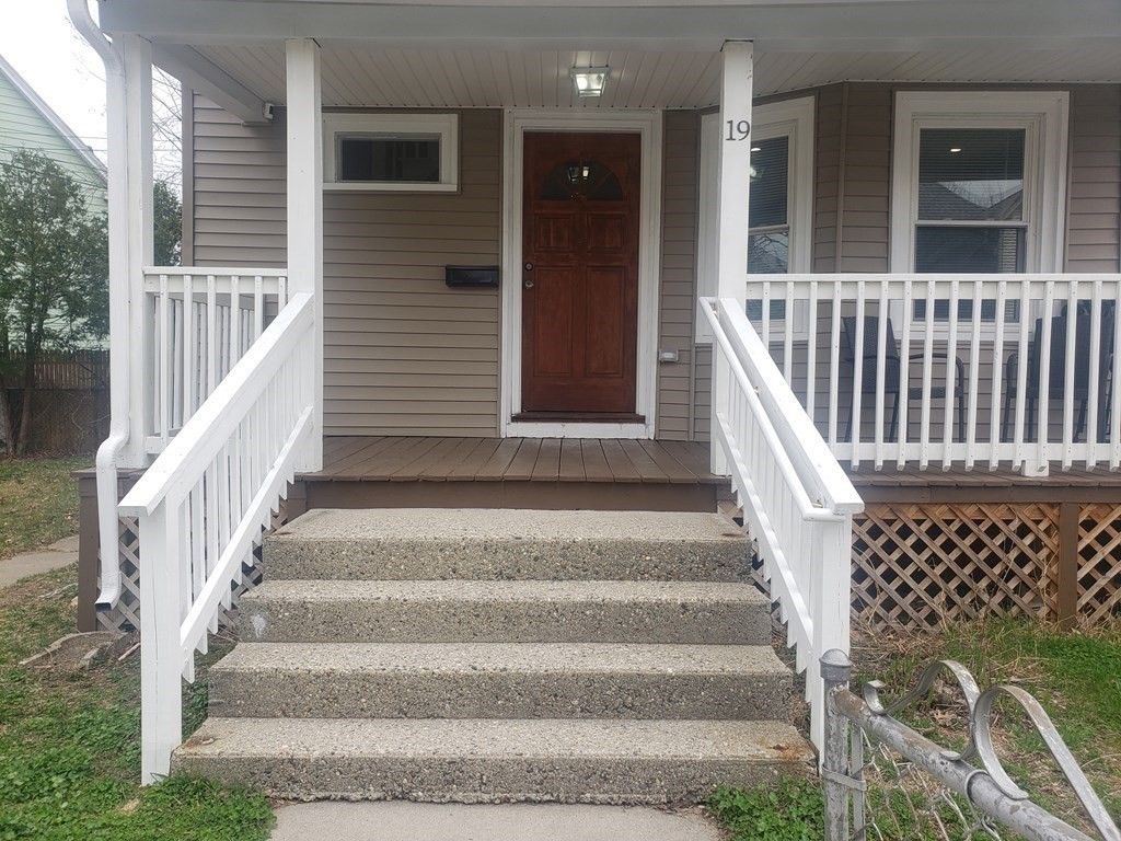 19 Wareham Street Springfield, MA 01108 - Photo 15 of 25 a view of staircase with white walls and windows
