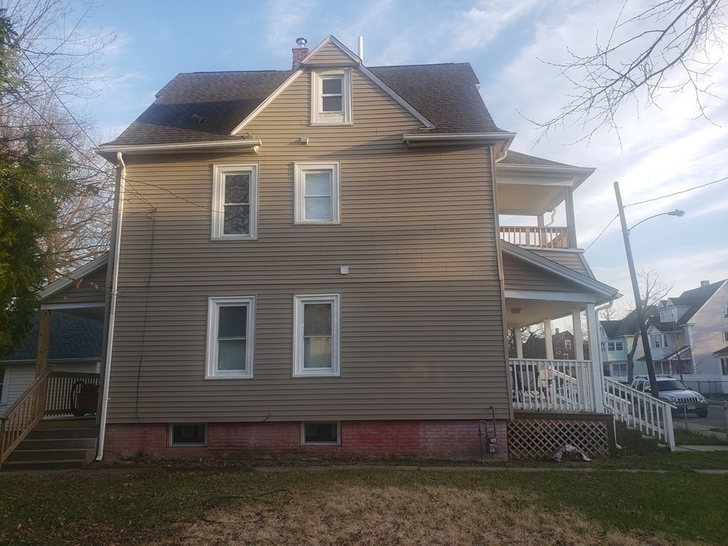 19 Wareham Street Springfield, MA 01108 - Photo 2 of 25 a front view of a house with a yard