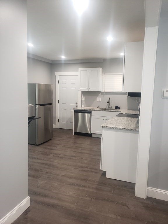 19 Wareham Street Springfield, MA 01108 - Photo 22 of 25 a kitchen with a refrigerator sink and cabinets