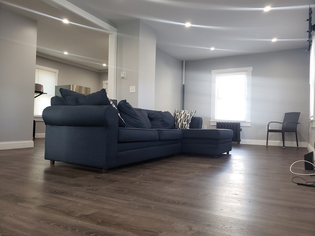 19 Wareham Street Springfield, MA 01108 - Photo 8 of 25 a living room with furniture and a wooden floor