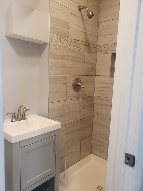 19 Wareham Street Springfield, MA 01108 - Photo 9 of 25 a bathroom with a sink a toilet and shower