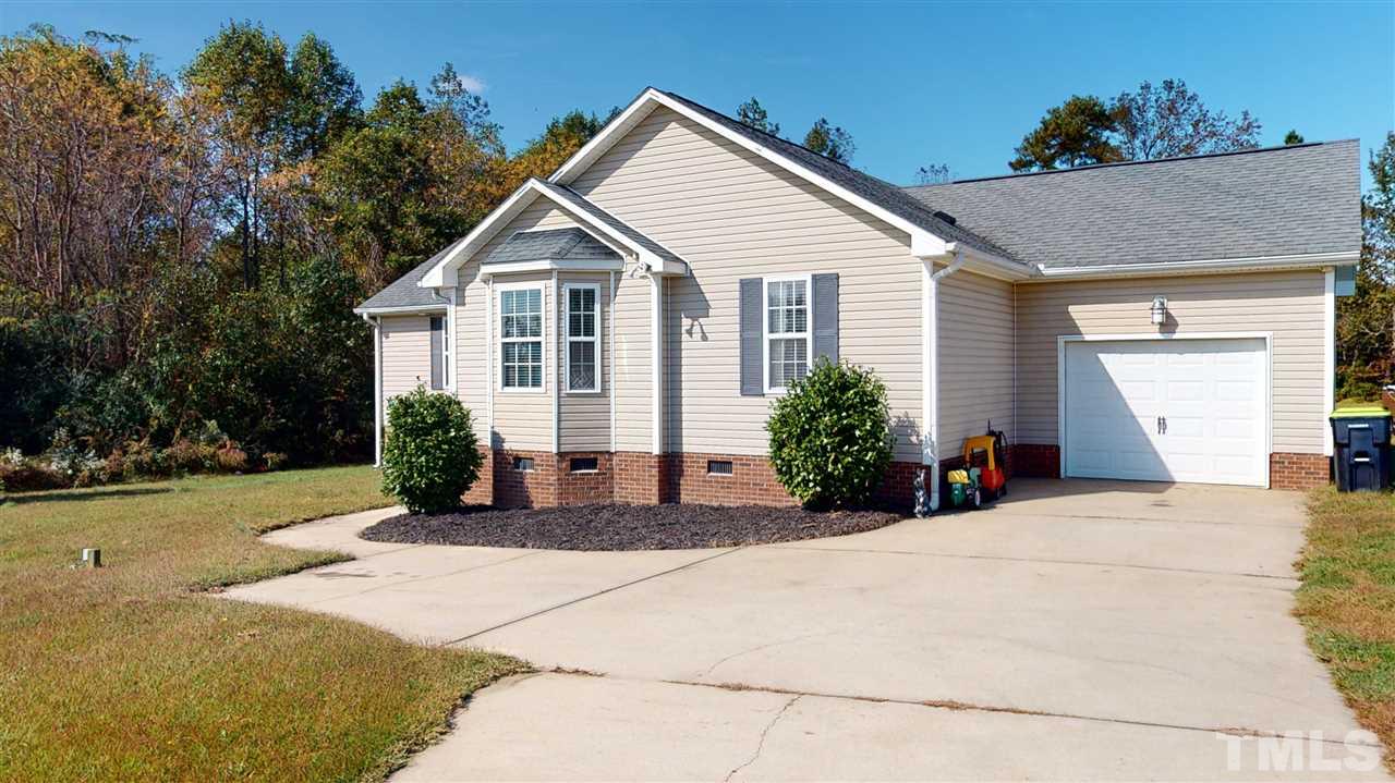 6558 Todd Road Bailey, NC 27807 - Photo 1 of 23 a view of a house with a yard and potted plants