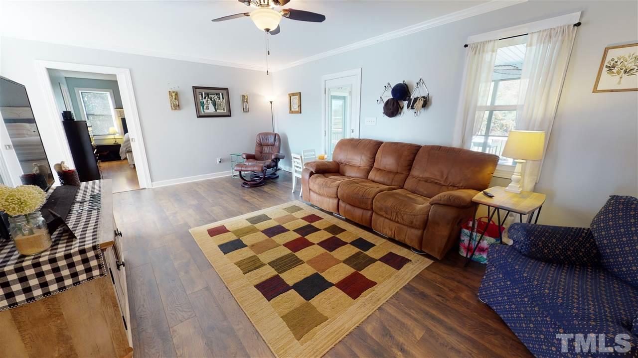 6558 Todd Road Bailey, NC 27807 - Photo 11 of 23 a living room with furniture and wooden floor