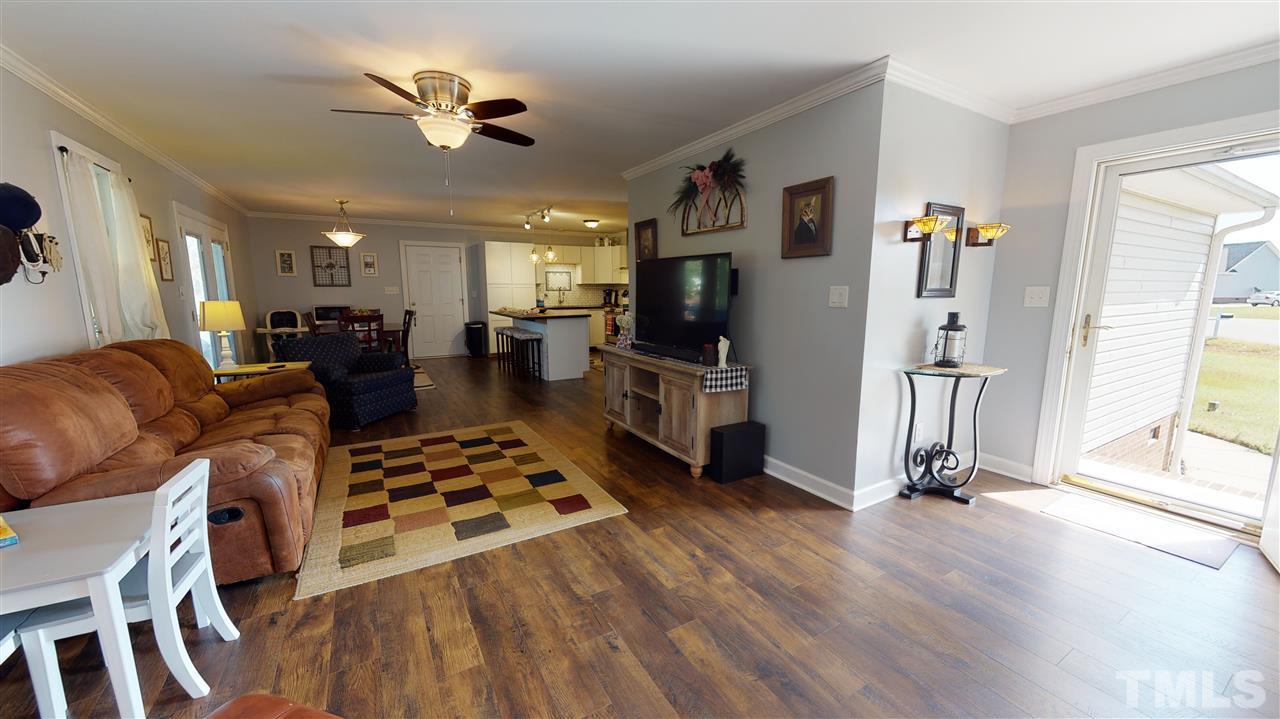6558 Todd Road Bailey, NC 27807 - Photo 12 of 23 a living room with furniture a flat screen tv and a table