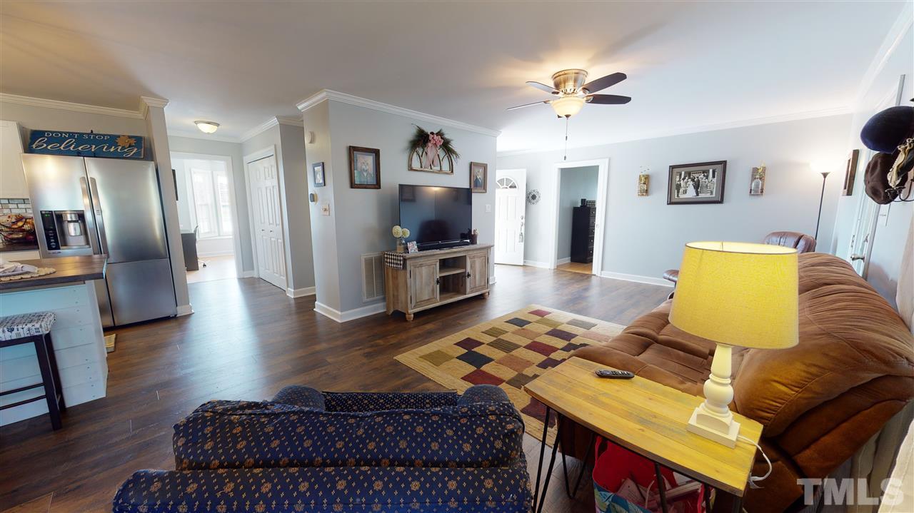 6558 Todd Road Bailey, NC 27807 - Photo 13 of 23 a living room with furniture and a flat screen tv