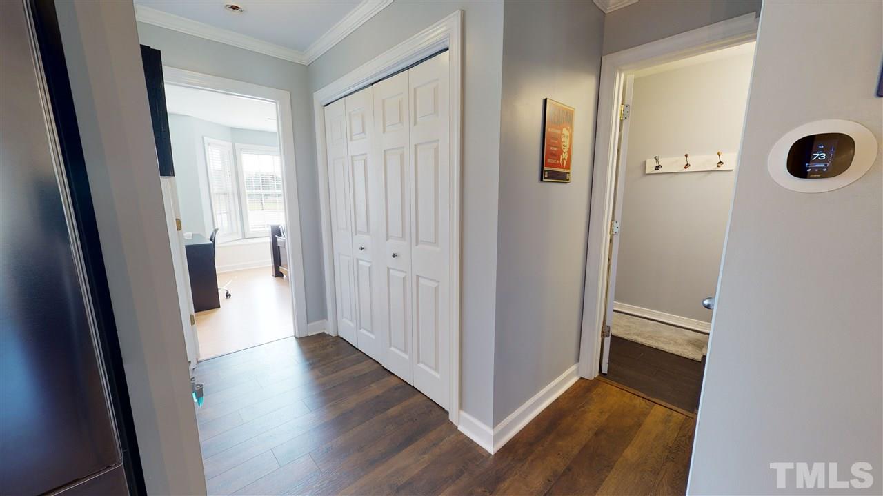 6558 Todd Road Bailey, NC 27807 - Photo 14 of 23 a view of a hallway with wooden floor