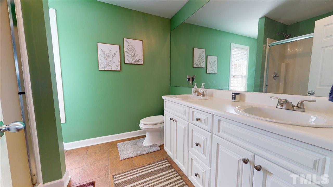 6558 Todd Road Bailey, NC 27807 - Photo 17 of 23 a bathroom with a sink and a mirror