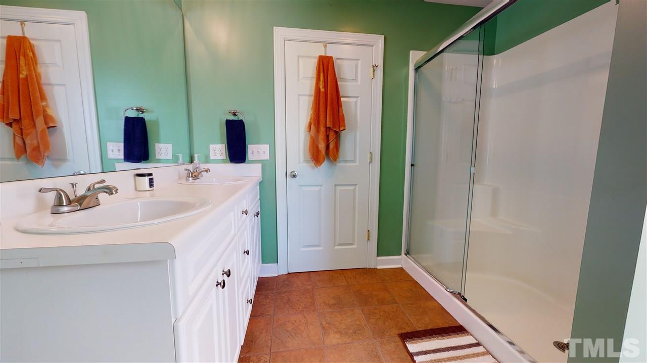 6558 Todd Road Bailey, NC 27807 - Photo 18 of 23 a bathroom with a sink and a mirror