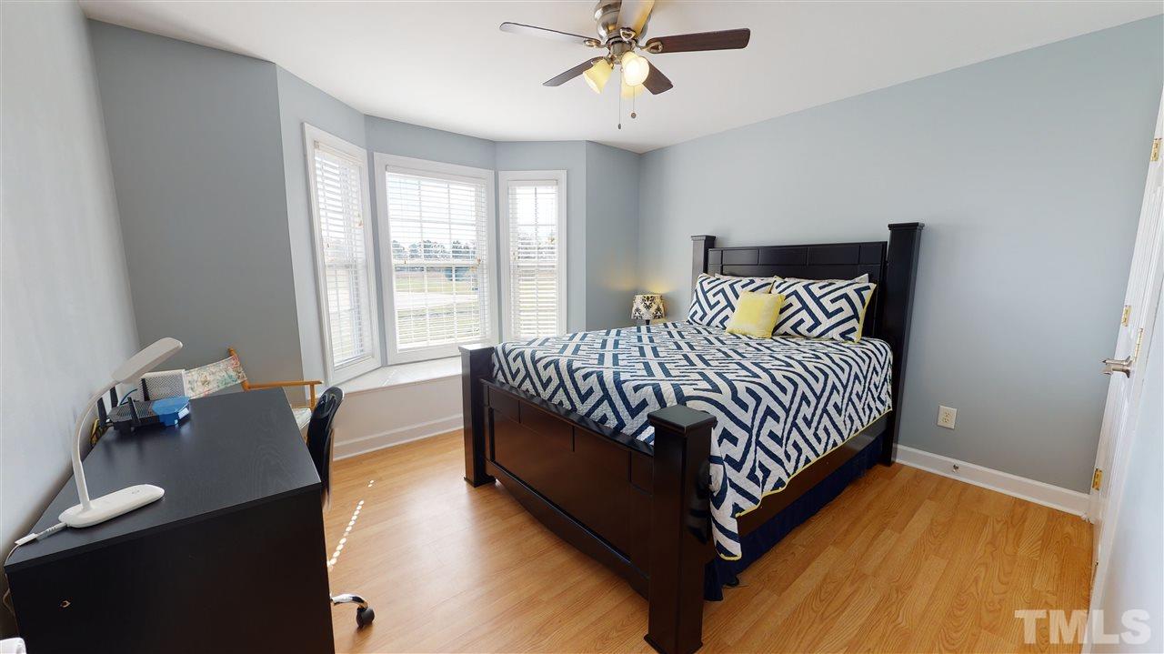 6558 Todd Road Bailey, NC 27807 - Photo 21 of 23 a bedroom with a bed and window