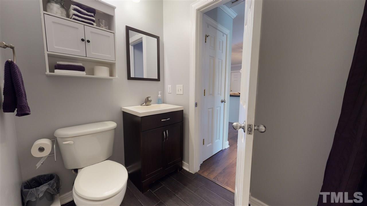 6558 Todd Road Bailey, NC 27807 - Photo 22 of 23 a white toilet sitting next to a bathroom sink