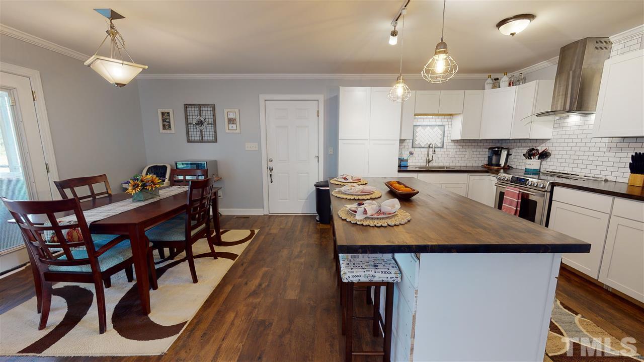 6558 Todd Road Bailey, NC 27807 - Photo 7 of 23 a view of a kitchen area and dining room