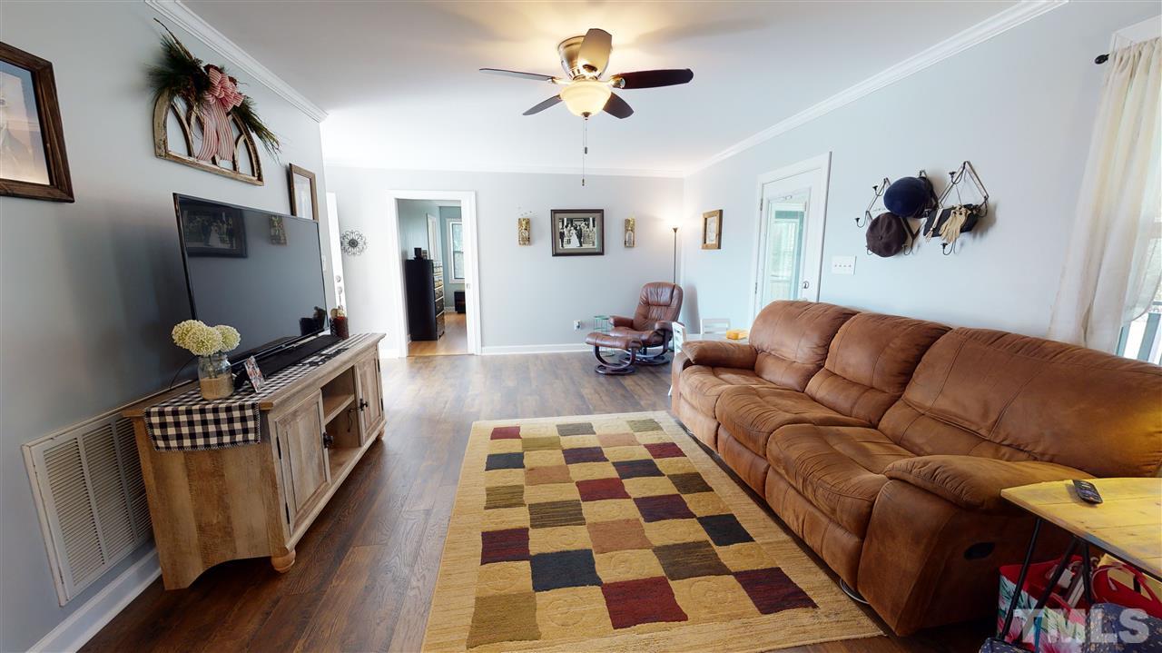 6558 Todd Road Bailey, NC 27807 - Photo 10 of 23 a living room with furniture and a rug