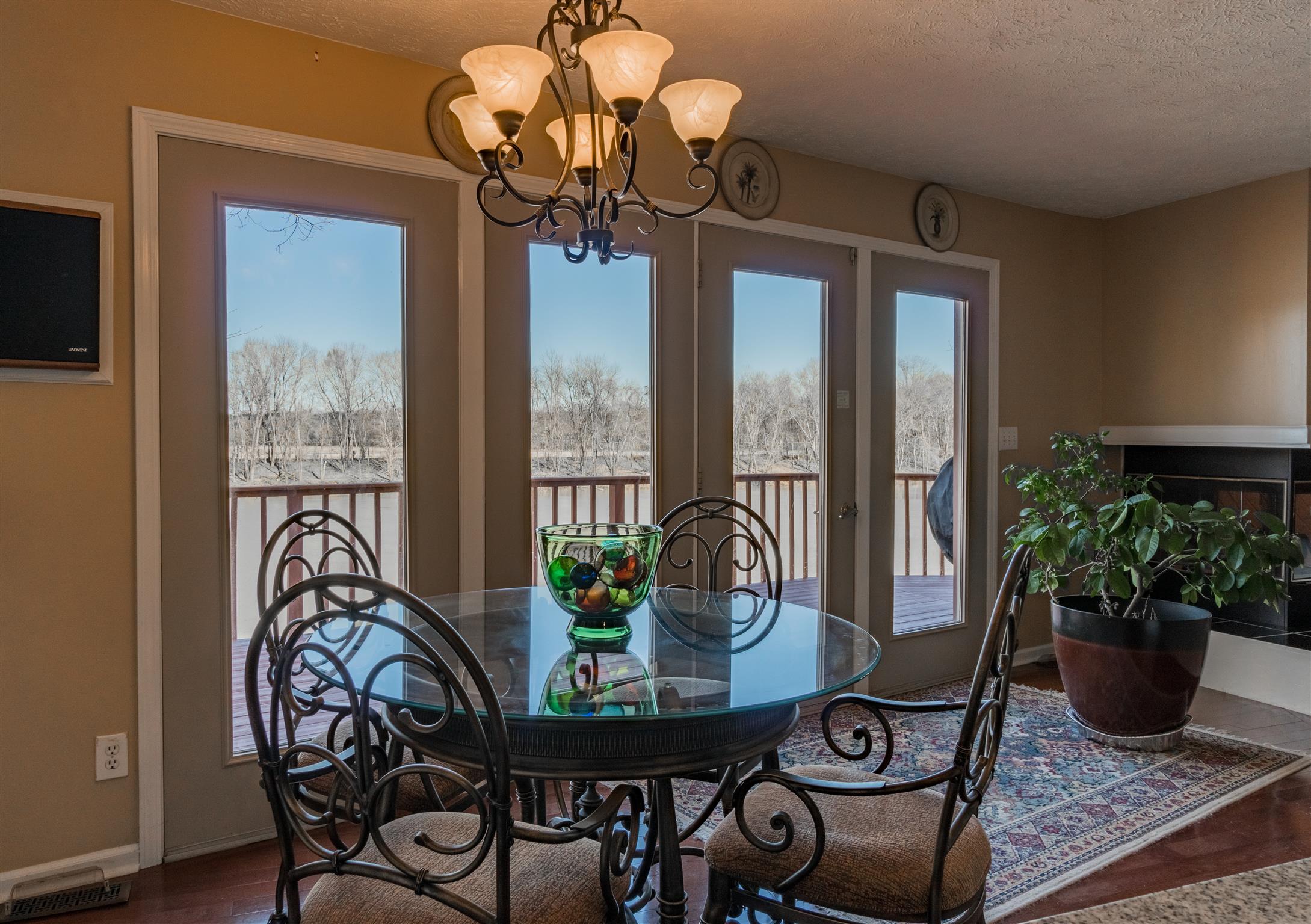 291 Mayhew Road Clarksville, TN 37040 - Photo 15 of 30 a dining room with furniture potted plants and wooden floor