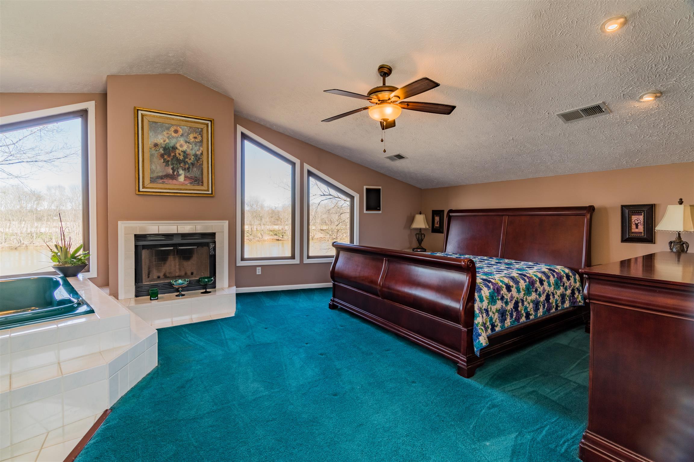 291 Mayhew Road Clarksville, TN 37040 - Photo 17 of 30 a bedroom with a bed and a fireplace