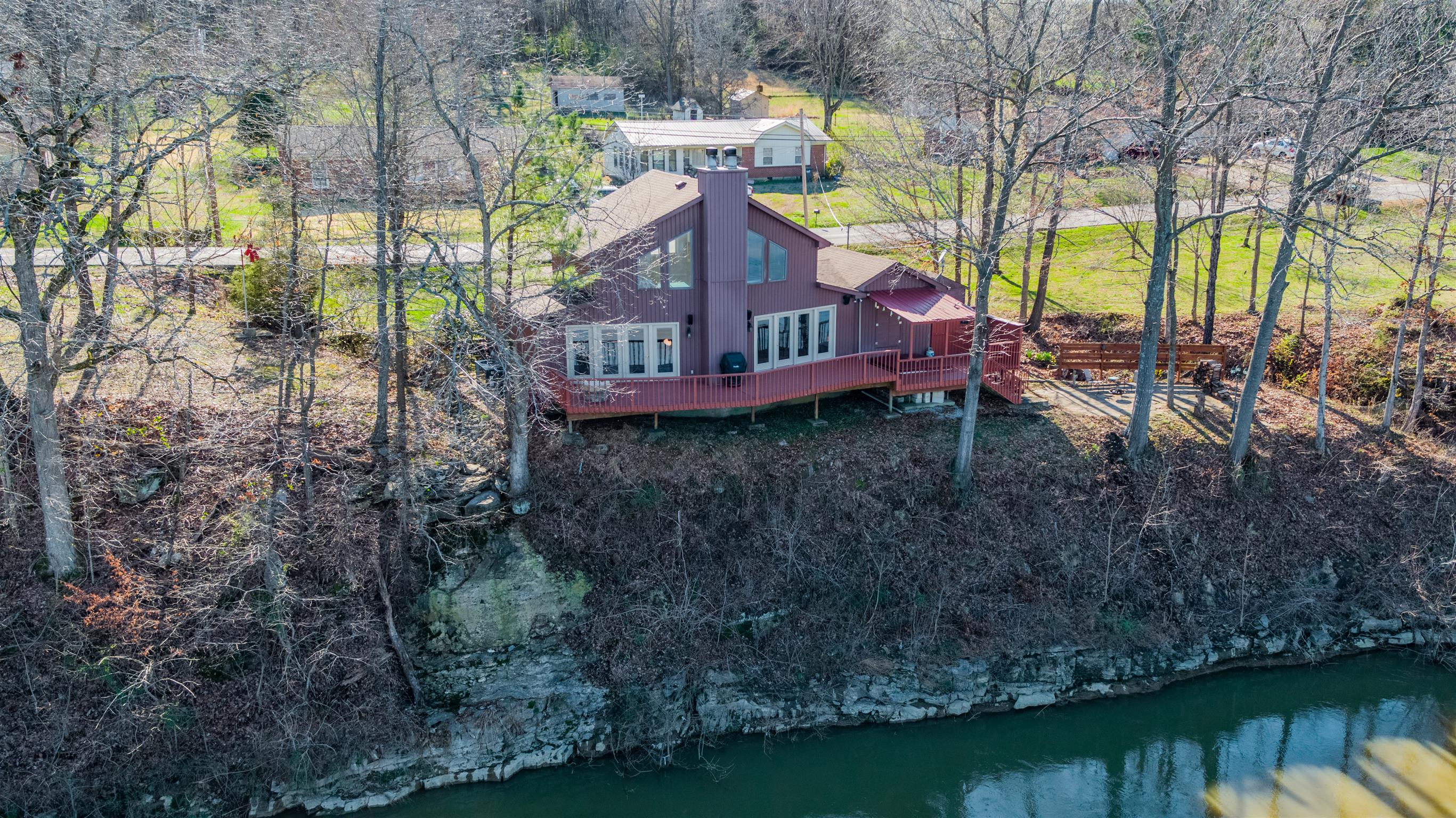 291 Mayhew Road Clarksville, TN 37040 - Photo 2 of 30 a view of a house with a yard from a lake view