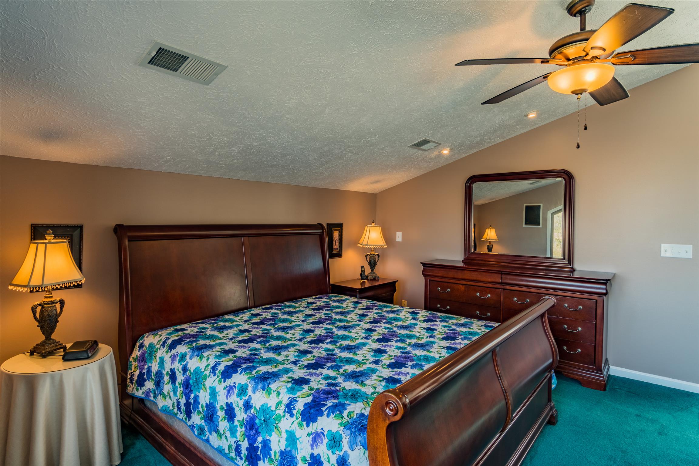291 Mayhew Road Clarksville, TN 37040 - Photo 21 of 30 a bedroom with a bed and a chandelier