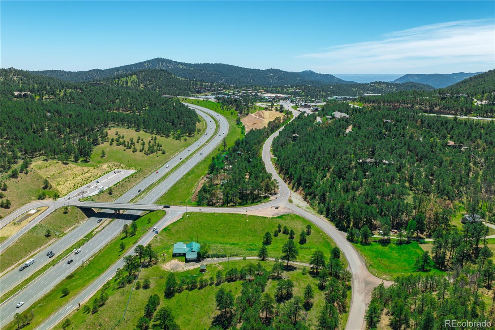 29793 Ruby Ranch Road Evergreen, CO 80439 - Photo 22 of 28 a view of a city with lush green forest