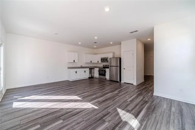 a view of kitchen with wooden floor