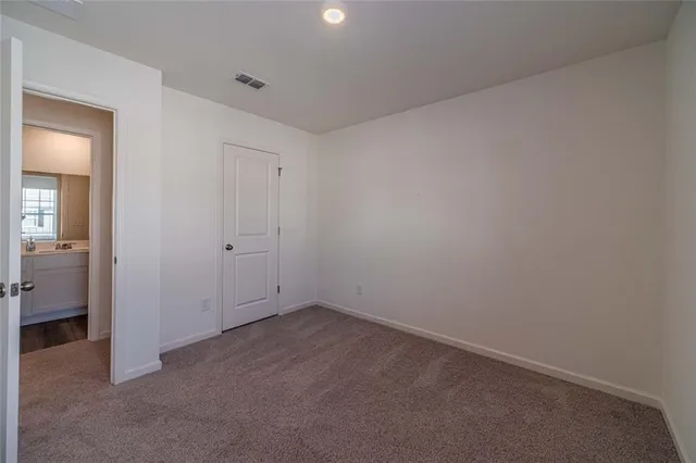 an empty room with a bathroom
