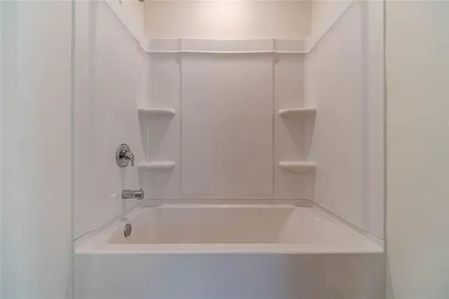 a bathroom with a bath tub