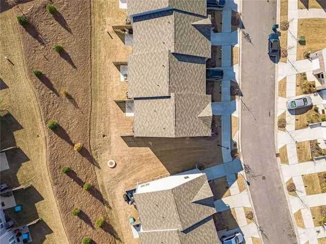 an aerial view of a house with a lot of residential buildings