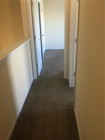 a view of backyard and wooden fence