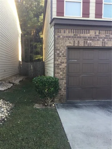a brick building with a yard