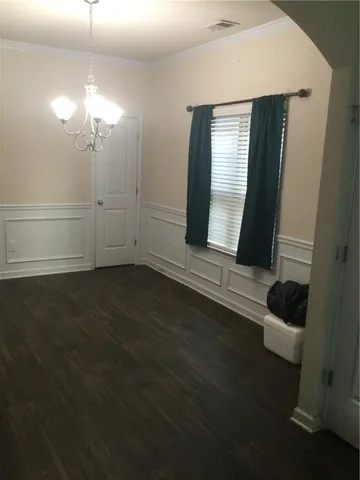 a kitchen with stainless steel appliances granite countertop a stove a refrigerator and a microwave