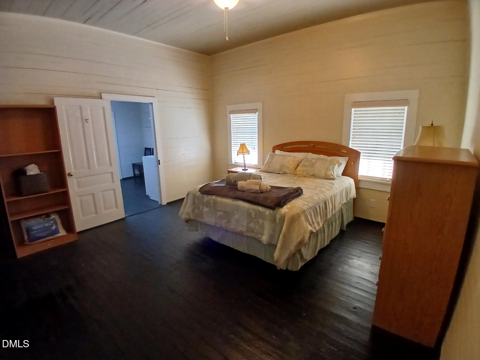 1920 Kelly Road Apex, NC 27502 - Photo 23 of 44 a bed room with a bed and a couch