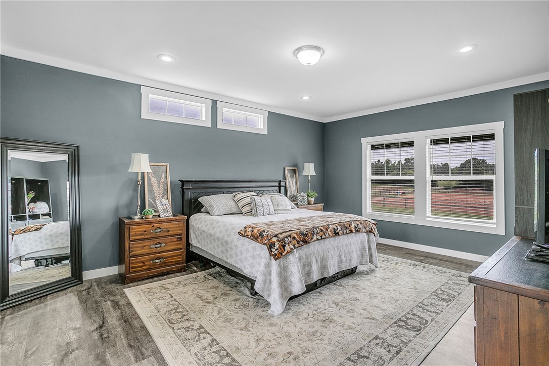 615 Wilson Road Central, SC 29630 - Photo 22 of 50 Generous windows fill this comfortable main-level bedroom with abundant natural light.