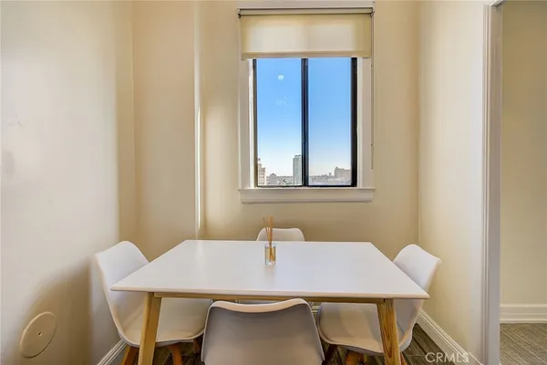 a dining room with a table and chairs