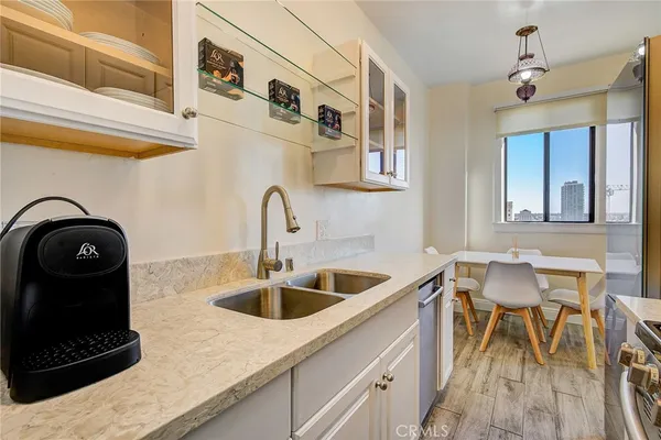 a kitchen with a sink and cabinets