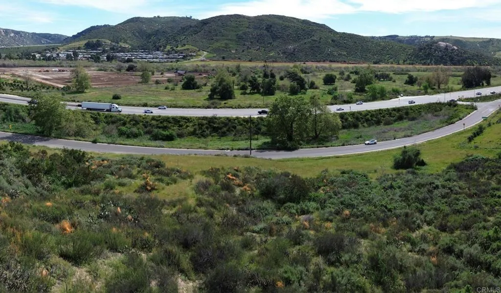 4216 Pala Road Fallbrook, CA 92028 - Photo 3 of 6 an aerial view of green landscape with trees houses and mountain view
