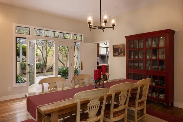 a kitchen with stainless steel appliances granite countertop a refrigerator a sink and a stove