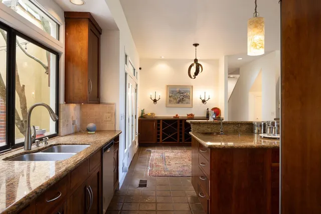 a wooden bench sitting in front of a building