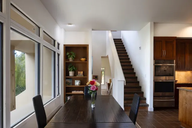 a view of balcony with furniture and garden
