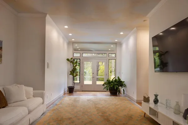 a bedroom with a large bed and a window