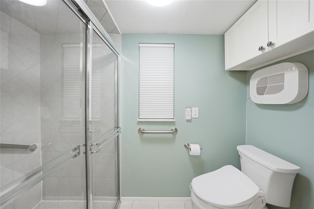 1 Colony Point Drive, Unit A10 Punta Gorda, FL 33950 - Photo 20 of 31 a white toilet sitting next to a bathroom sink