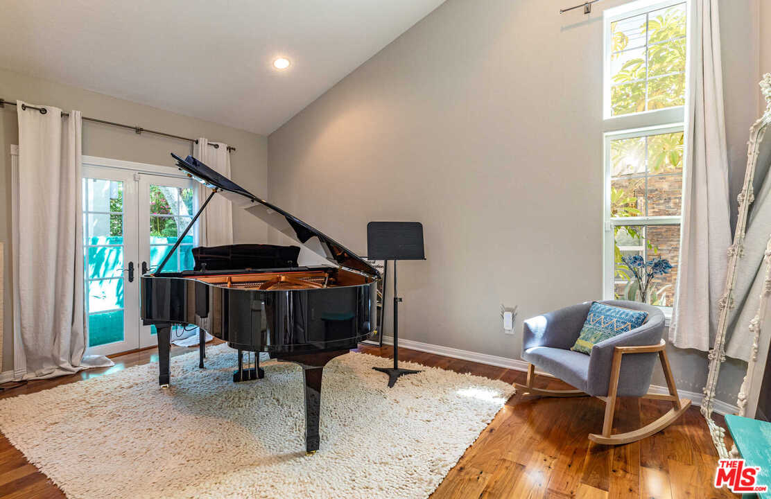 374 East Rustic Road Santa Monica, CA 90402 - Photo 13 of 21 a living room with furniture and a window