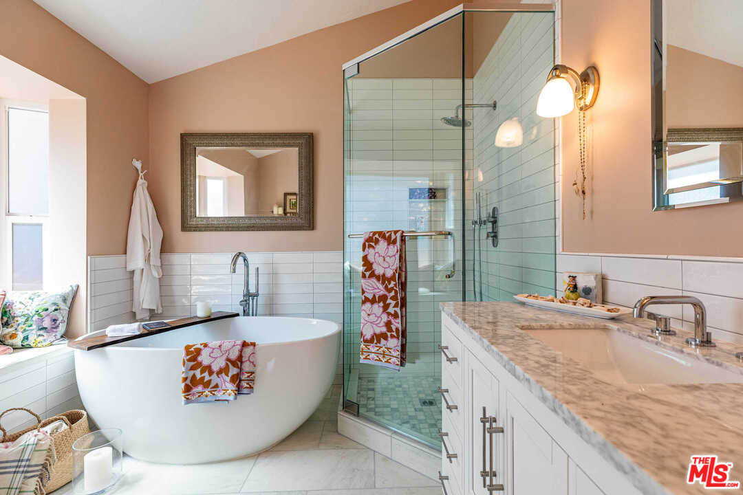 374 East Rustic Road Santa Monica, CA 90402 - Photo 16 of 21 a bathroom with a granite countertop sink and a mirror