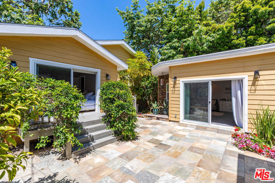374 East Rustic Road Santa Monica, CA 90402 - Photo 18 of 21 a view of house with outdoor space and garden