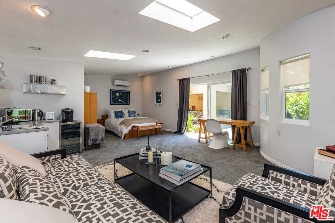 374 East Rustic Road Santa Monica, CA 90402 - Photo 20 of 21 a living room with furniture and a window
