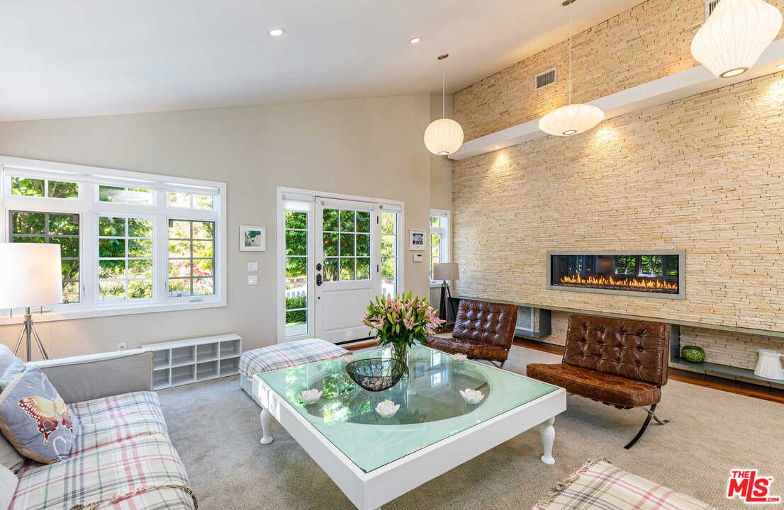 374 East Rustic Road Santa Monica, CA 90402 - Photo 4 of 21 a living room with furniture and a large window