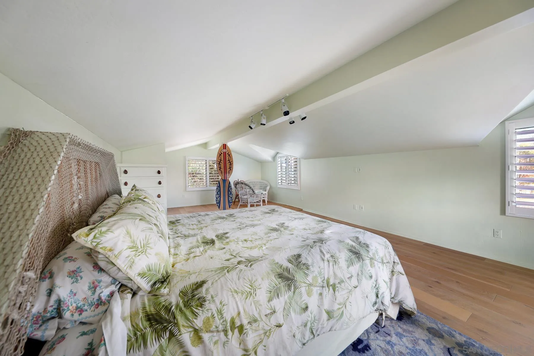 13764 McNally Road Valley Center, CA 92082 - Photo 12 of 26 a bed sitting in a bedroom and dressers