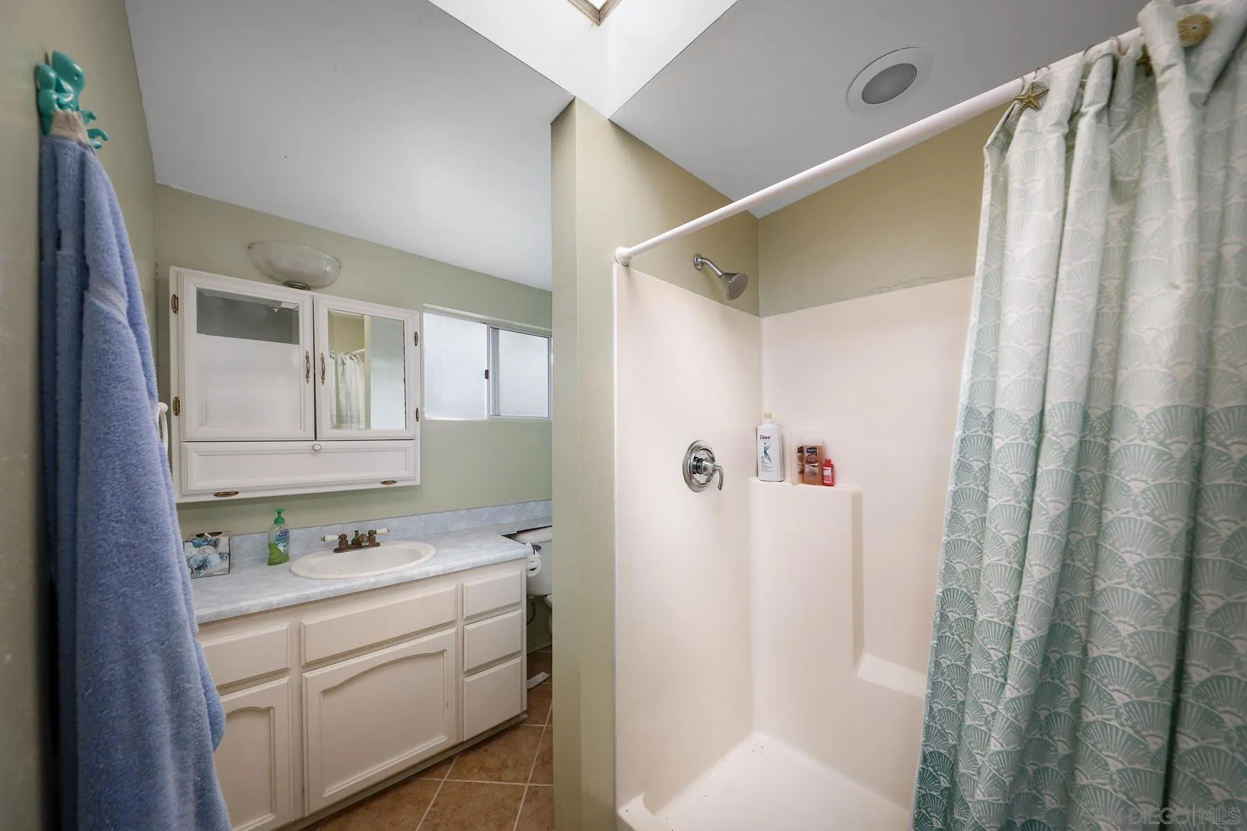 13764 McNally Road Valley Center, CA 92082 - Photo 13 of 26 a bathroom with a sink and a mirror