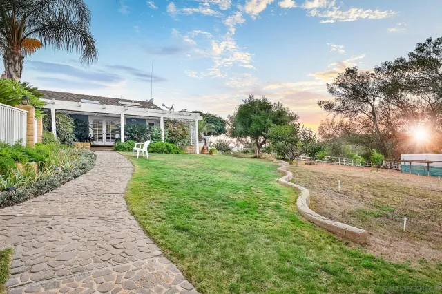 a view of a house with a swimming pool