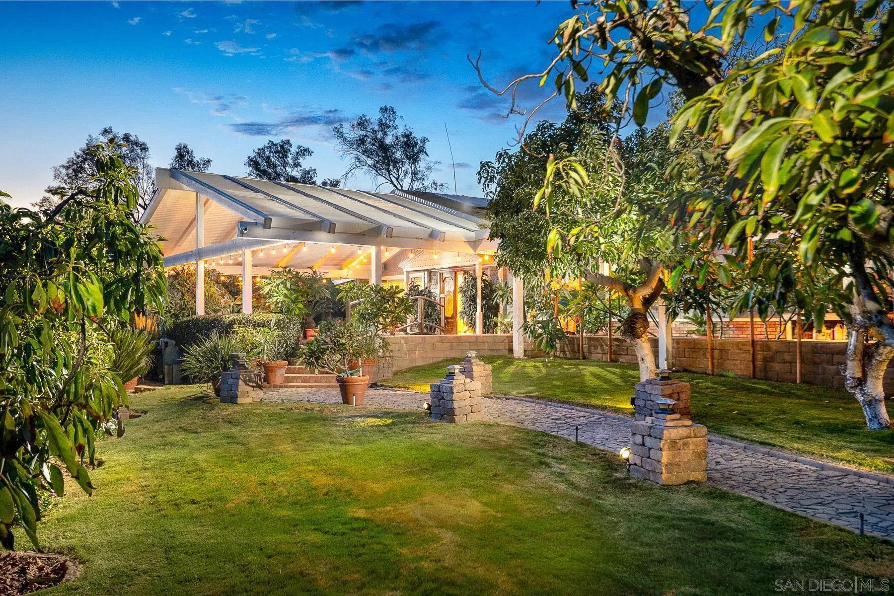 13764 McNally Road Valley Center, CA 92082 - Photo 20 of 26 a backyard of a house with barbeque oven table and chairs