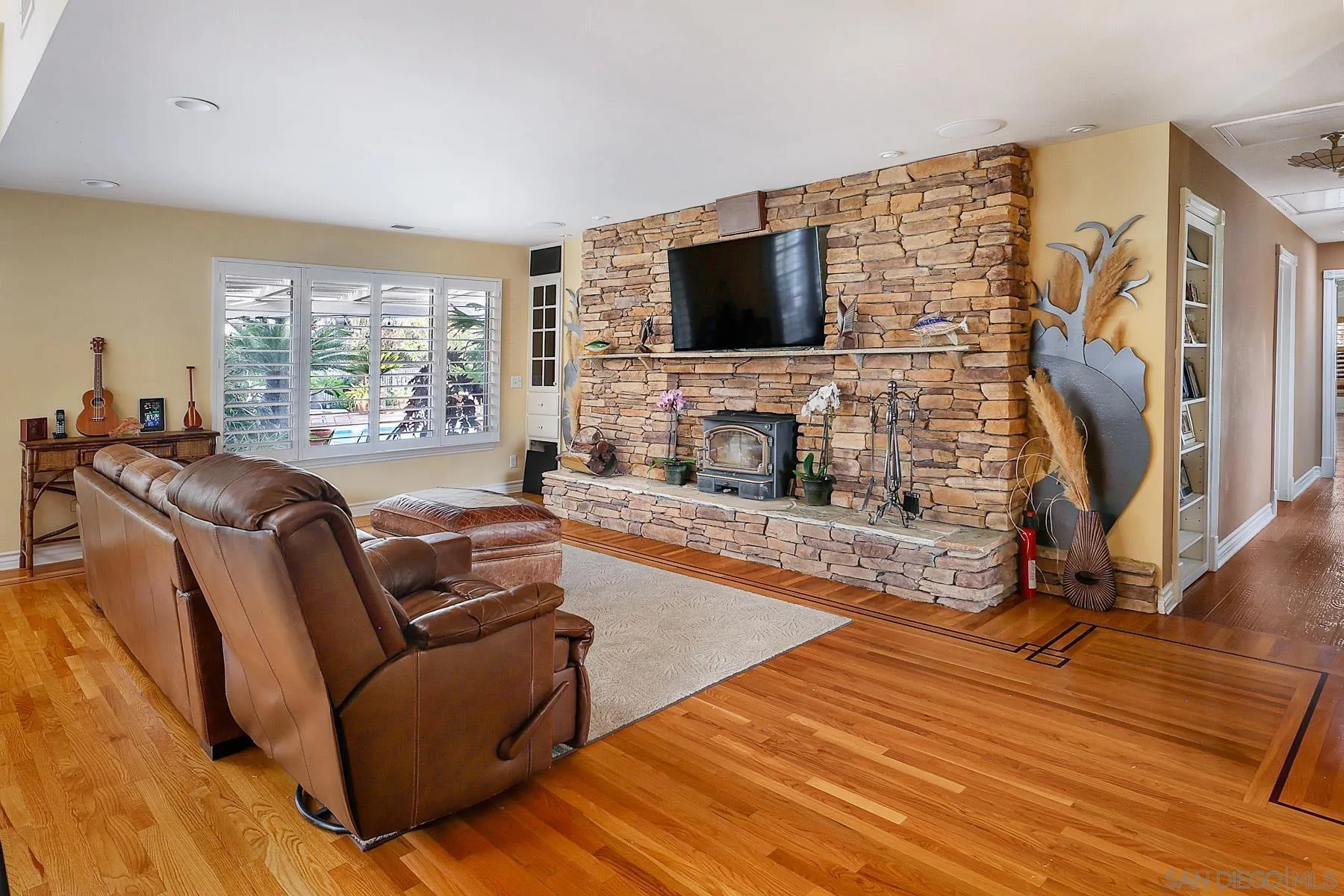 13764 McNally Road Valley Center, CA 92082 - Photo 5 of 26 a living room with furniture and a flat screen tv