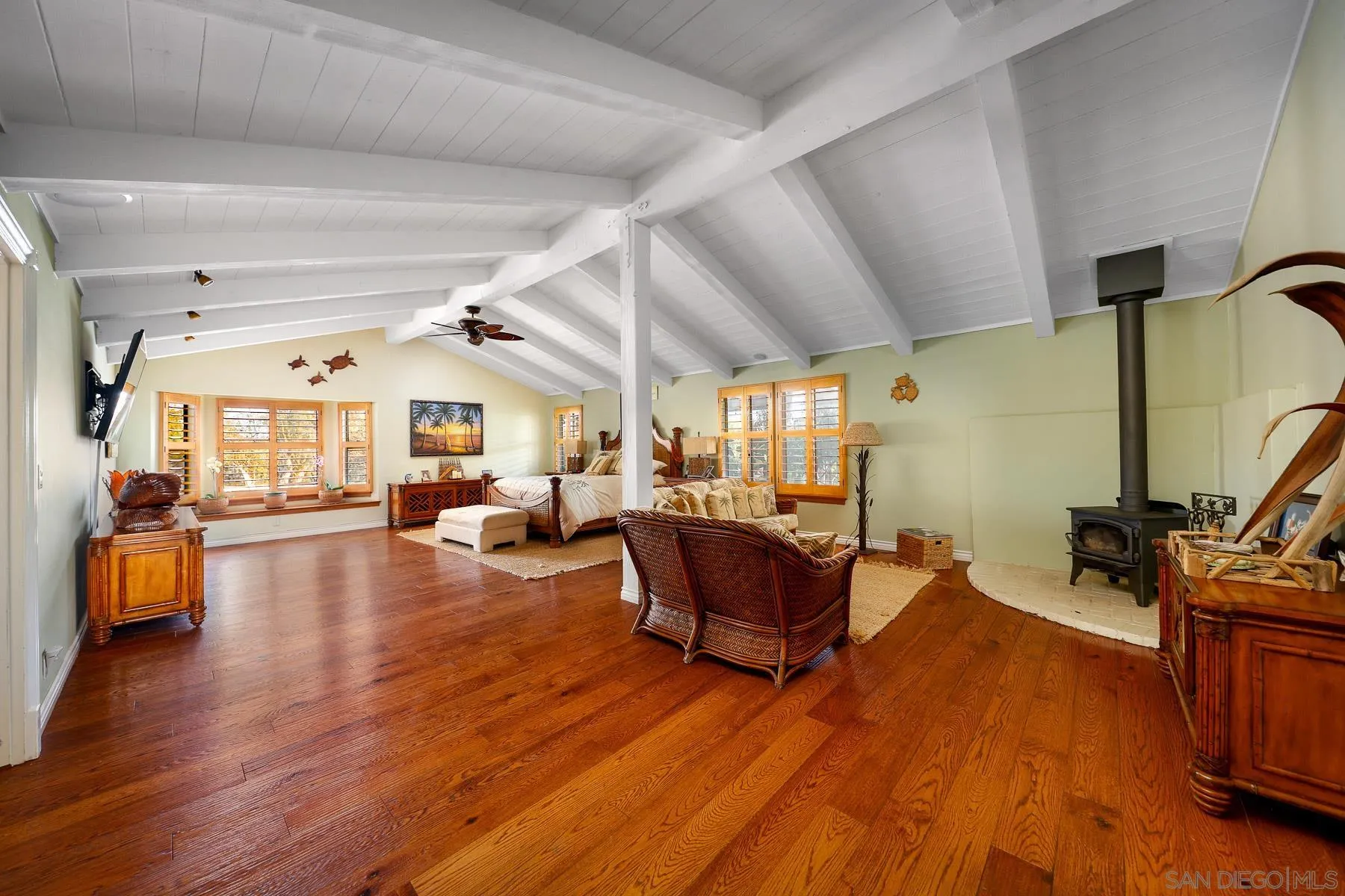 13764 McNally Road Valley Center, CA 92082 - Photo 7 of 26 a living room with furniture a wooden floor and a sink