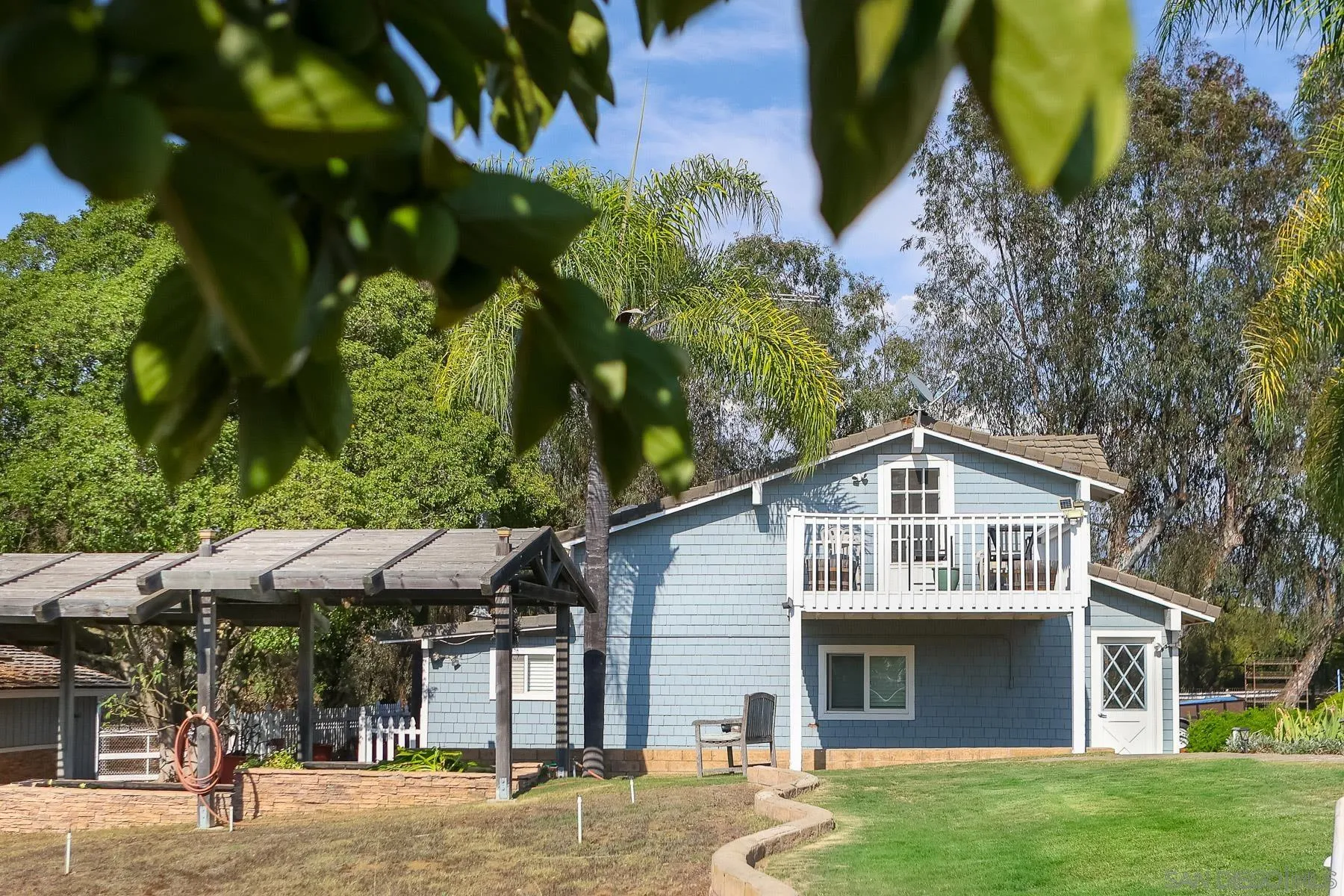 13764 McNally Road Valley Center, CA 92082 - Photo 10 of 26 a view of a house with a swimming pool